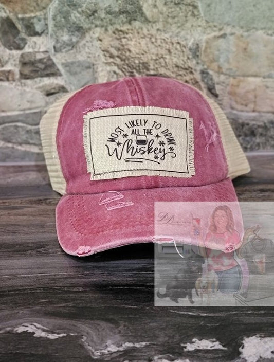 Most Likely to Drink all The Whiskey Distressed Criss Cross Pony Tail Hat
